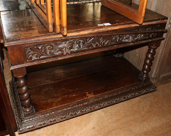 A Victorian carved oak two tier table